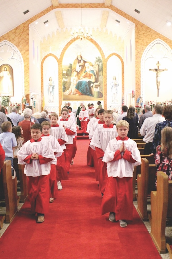 Altar boys walking during mass at St Ann Church Kosciusko