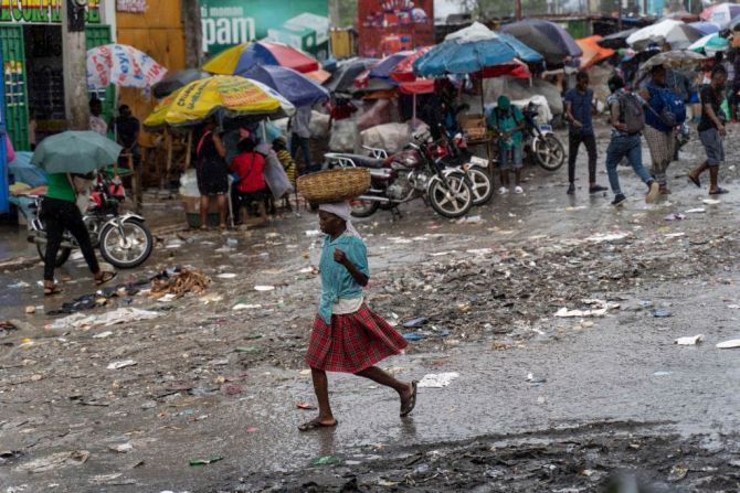 woman walking on a street in Haiti