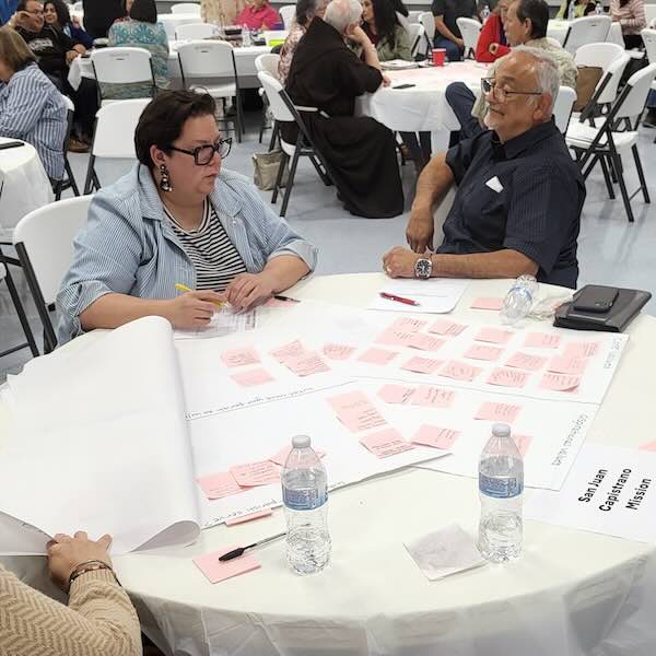 people sitting around a table talking