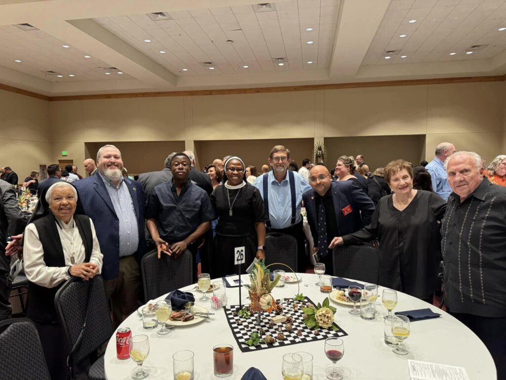 Knights of Columbus members with clergy and religious at dinner