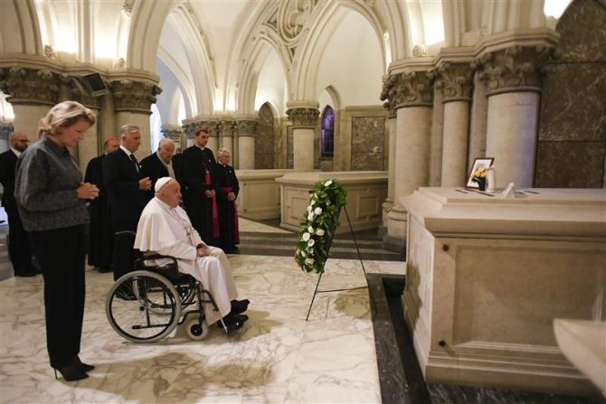 Pope Francis prays on Sept. 28, 2024, at the tomb of Belgian king