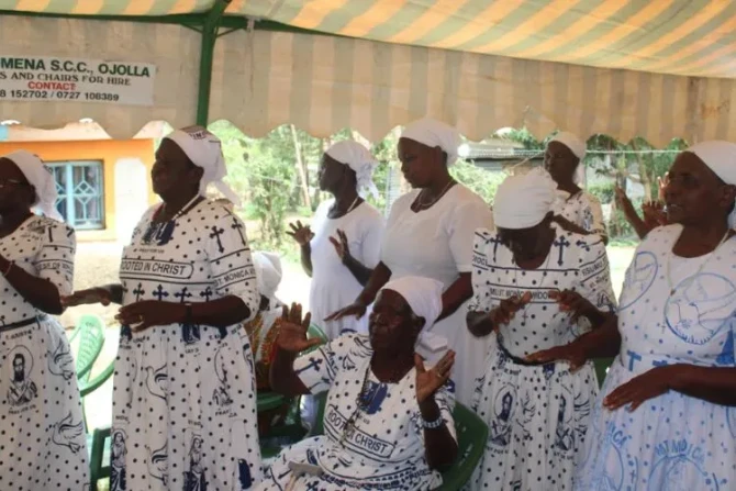 Members of St. Monica Widows Group pray during Mass