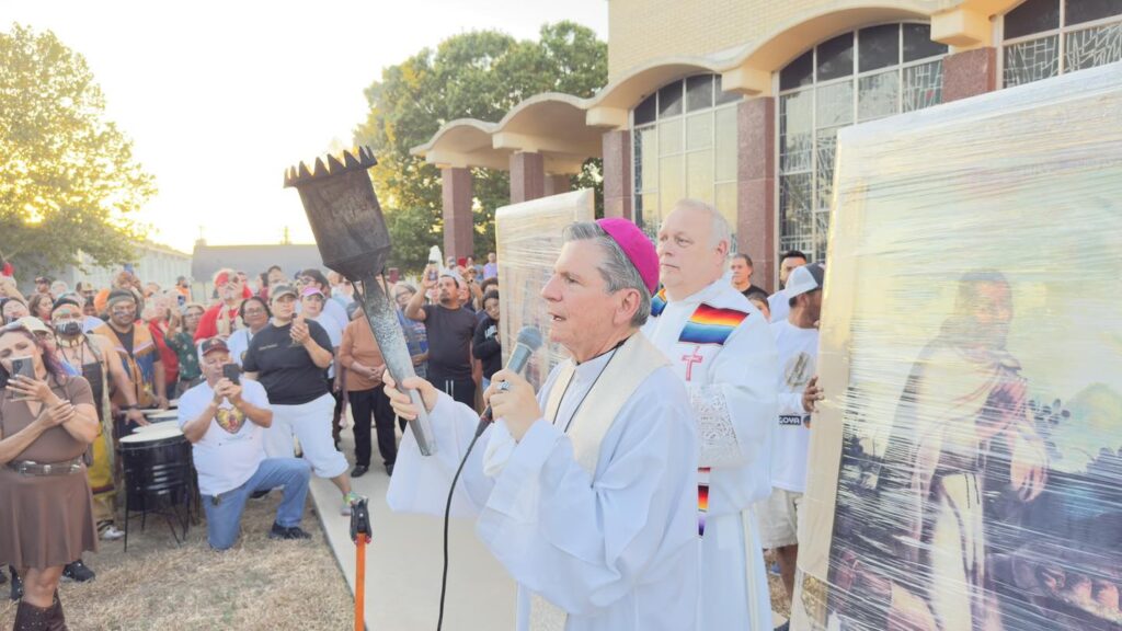 Archbishop Gustavo holding a microphone