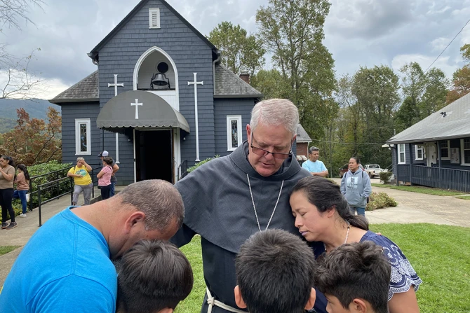 Bishop Michael Martin prays with victims of Hurricane Helene