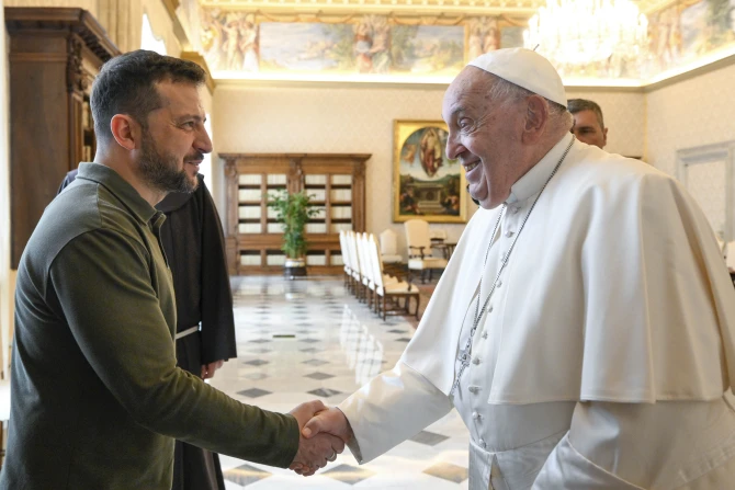 Ukraine President Volodymyr Zelenskyy shakes hands with Pope Francis