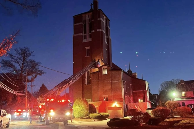 Firefighters work to extinguish the fire at St. Mary Church in Franklin, Massachusetts