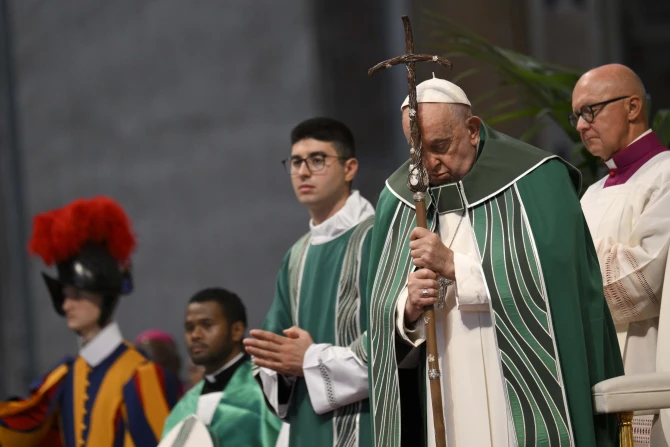 Pope Francis prays during the Synod on Synodality